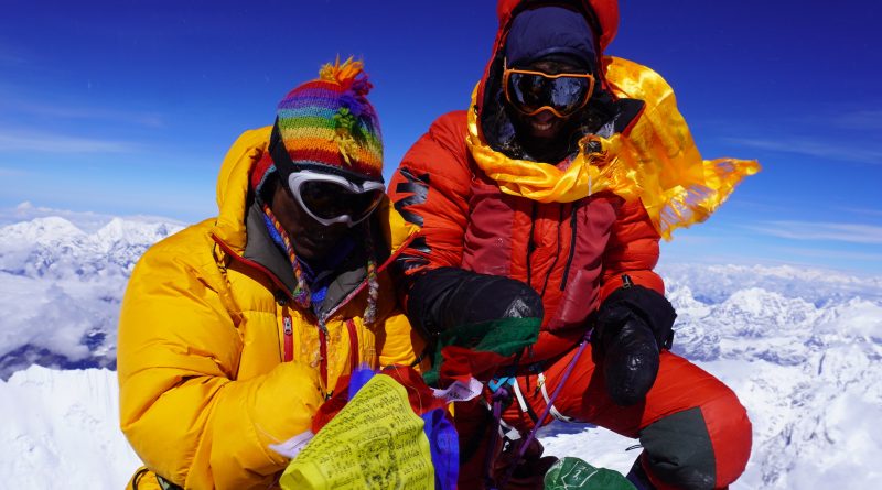 mountaineers Felix Berg and Renji Sherpa on Mount Everest Summit