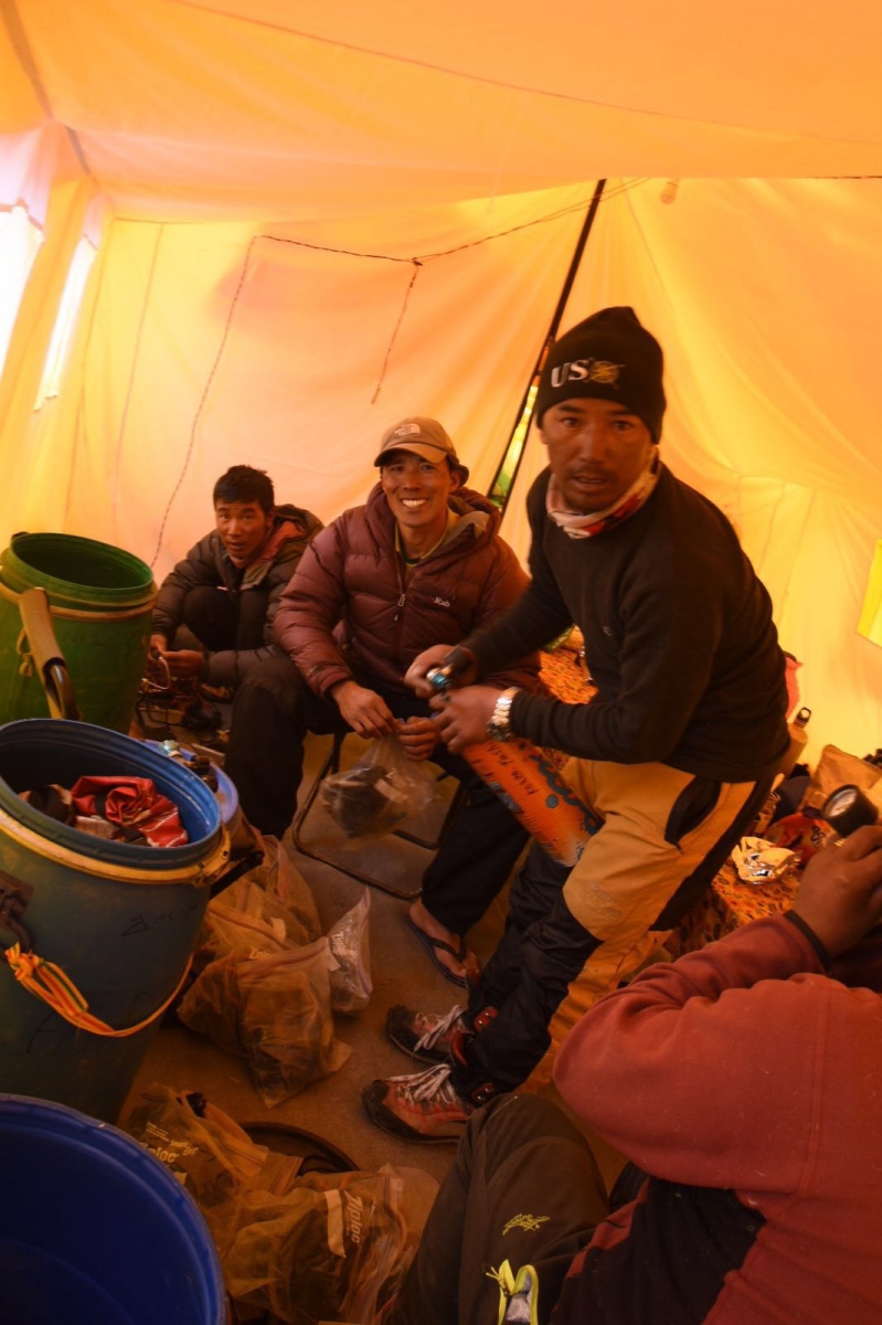 Team sherpa working and resting in Kitchen tent before going for summit.  Katya Photo   
