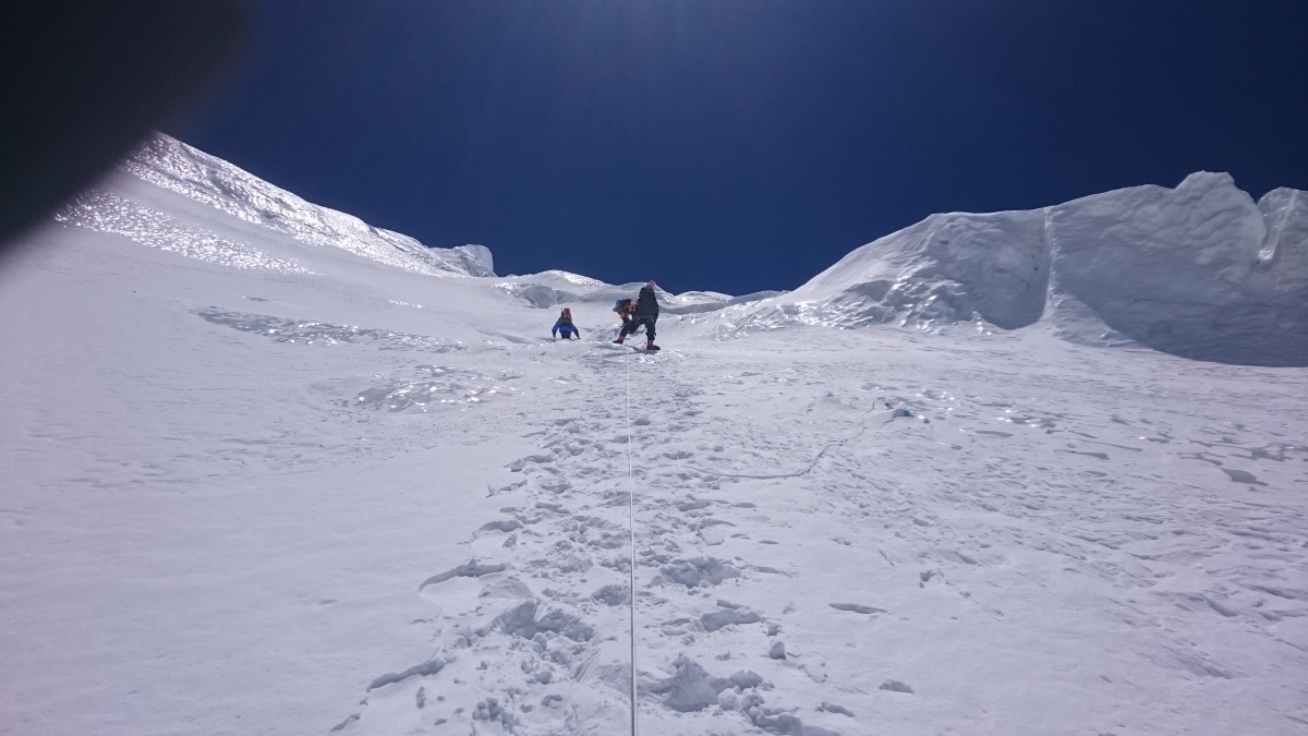 Climbers are on vertical iceclimb with the help of fixed rope. Photo Fredrik Johansson  
